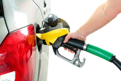Closeup refuel gasoline in gas-station on white background
