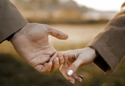close-up-couple-holding-hands-outside
